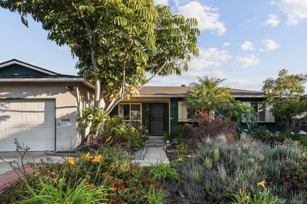 Welcome to 8045 Laird Street, a beautifully updated single-story home in the heart of La Mesa’s highly sought-after Lake Murray Village neighborhood. This charming 4-bedroom, 2-bathroom residence sits on a spacious 6,500 sq ft, lushly landscaped lot with panoramic views. This home offers a perfect blend of classic character and modern upgrades. Step inside to discover refinished original hardwood floors, abundant natural light, and a warm, inviting layout ideal for families or entertaining. The bright kitchen flows seamlessly into the dining area and living room, creating a functional and open living space. Enjoy morning coffee or sunset views from the large backyard, which features mature landscaping, an attached 2-car garage, and plenty of room for outdoor dining, gardening, or play. The elevated lot offers peaceful views and added privacy, while the quiet street provides a true neighborhood feel. Located just minutes from Lake Murray, top-rated schools, parks, shopping, and freeway access, this move-in ready gem combines comfort, convenience, and classic La Mesa charm.