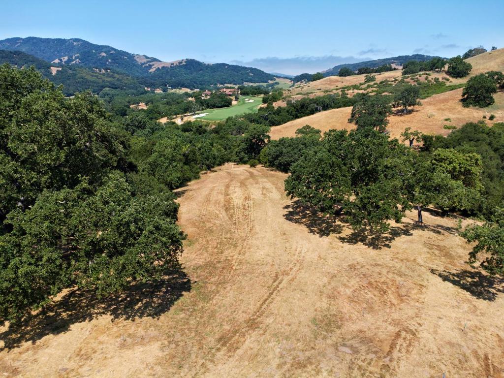 This exceptional 22+ acre golf course property is a rare opportunity for those who live and breathe the game. Situated in a uniquely beautiful setting, this residential lot offers direct access to the Preserve Golf Clubs renowned Tom Fazio-designed course. A short driveway leads to the 2 acre building envelope winding past the tee box of the challenging 18th hole, with expansive views of the fairway and the majestic Santa Lucia Mountains beyond, truly a one-of-a-kind location. A short walk or cart ride away are the Preserve Golf Clubhouse and first tee, making this homesite both exclusive and convenient. The Santa Lucia Preserve offers a seamless lifestyle in a secure, private, and natural environment, with 100 miles of private trails for hiking, biking, and horseback riding. Membership in the Preserve Golf and Ranch Clubs offers access to golf, equestrian and sports facilities, an 18-acre lake, and a historic 1920s Hacienda for lodging, dining, year-round events, and summer camps. This parcel allows for a main residence, guest house, and ADU. Water, sewer, fiber-optic communications, and utility conduits have been brought to the building envelope to ease construction. Santa Lucia Preserve is a private, gated community offering unparalleled tranquility and refined living.