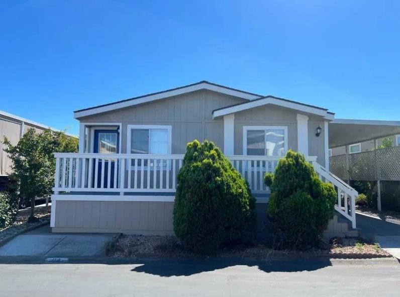 Come check out this stunningly revamped gem nestled in a peaceful 55+ community! With a fresh coat of paint inside and out, a brand-new roof, shed, and waterproof flooring, this place is a total knockout! Boasting two cozy bedrooms and two bathrooms, you'll feel right at home. The kitchen is perfect with loads of cabinet space and a cooktop stove. The primary bedroom is your personal retreat featuring a fabulous en-suite bathroom with a tub and shower just begging for relaxation. Plus, the newly painted deck is perfect for outdoor relaxation. Complete with A/C and laundry hook-ups, this home is in one of the most wonderful communities around. So, grab your bags Sunset Estates #84 is move-in ready and waiting for you! *The above information including square footage is based on data received from the seller and/or from public sources. This information is deemed reliable but has not been independently verified and cannot be guaranteed. Prospective buyers are advised to verify information to their own satisfaction prior to purchase. Pictures may not depict exact home details.