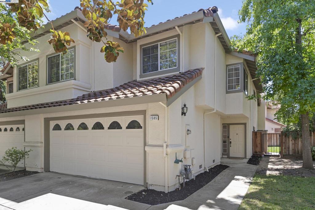 Welcome to 1585 Poppybank Court, a beautifully updated 4-bedroom, 2.5-bath duet tucked in a quiet court in one of Pleasanton’s most desirable neighborhoods. This move-in ready home offers comfort, style, and a prime location near top-rated schools, downtown, shopping, and major commuter routes. The recently remodeled kitchen features quartz countertops, upgraded cabinetry, new stainless-steel appliances, and a breakfast bar. The adjacent dining area opens to the backyard—ideal for indoor-outdoor living. Upstairs, the spacious primary suite boasts vaulted ceilings, a custom walk-in closet, and a renovated en-suite bath with soaking tub and stall shower. Three additional bedrooms provide flexibility for guests, family, or a home office. The updated guest bath includes smart mirrors and modern finishes, plus a main-level powder room for added convenience. Additional highlights: hardwood floors downstairs, new carpet upstairs, dual-pane windows, new blinds, copper plumbing, central A/C, laundry room, and a two-car garage. Enjoy the low-maintenance backyard with a new fence—perfect for relaxing or entertaining in a peaceful neighborhood.