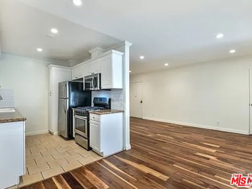Discover the charm of West Hollywood living at 1112 N Olive Dr #6, a spacious and inviting 2-bedroom, 2-bath apartment in one of the city's most sought-after neighborhoods. This bright and welcoming unit offers a comfortable layout with generous bedrooms, a private balcony perfect for morning coffee or evening sunsets, and a kitchen complete with a microwave for added convenience. Enjoy the ease of a community washer and dryer, while your private garage provides one dedicated parking space plus an additional storage area right by your spot. The building features a lovely communal outdoor space where residents can relax and unwind in a peaceful setting, and the pet-friendly policy means your furry companions are welcome too. Nestled between the iconic Sunset Strip and Santa Monica Boulevard, this home places you moments away from world-class dining, trendy coffee shops, vibrant nightlife, and boutique shopping. Whether you're exploring nearby Runyon Canyon, grabbing brunch at a local hotspot, or catching live music, you'll love the unbeatable energy and convenience of this neighborhood.1112 N Olive Dr #6 is more than just an apartment; it's your chance to enjoy the best of West Hollywood living in a home that blends charm, comfort, and location. Tenant pays utilities except water.