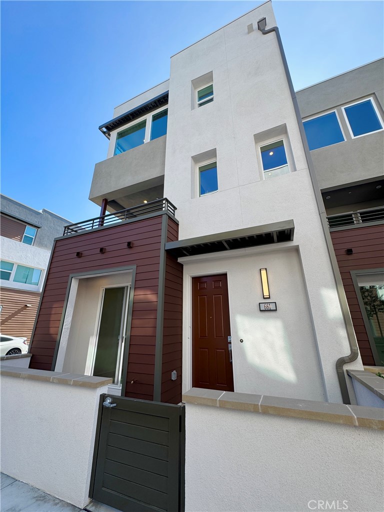 Experience modern luxury in this brand-new Toll Brothers home, featuring PAID SOLAR panels and perfectly positioned as a premium corner unit with abundant natural light from numerous windows. Located within a gated community, this 3-bedroom, 2.5-bathroom+ Bonus Office residence offers an expansive kitchen that opens to a spacious great room — ideal for entertaining. A private outdoor balcony provides the perfect spot to relax or enjoy extra storage, while the third-floor location ensures beautiful, unobstructed scenic views. Elegant designer touches include quartz countertops, modern beige cabinetry, and luxury vinyl plank flooring throughout. Brand-new appliances — refrigerator, washer, and dryer — are all included for your convenience. A private SIDE BY SIDE 2-car garage and access to the highly rated Tustin Unified School District add to the appeal. Situated just minutes from Downtown Santa Ana, 4th Street Market, South Coast Plaza, major freeways, and John Wayne Airport, this home offers a perfect blend of style, energy efficiency, and unbeatable location.
