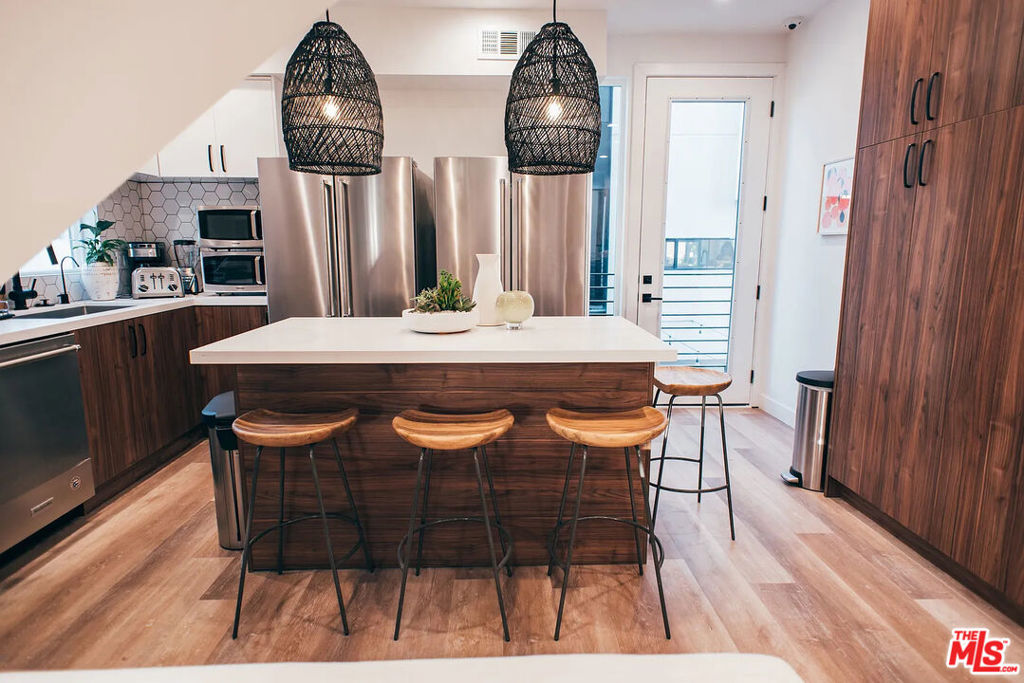 ** 1 MONTH FREE PROMO - SEE FULL DESCRIPTION ** PET FRIENDLY ** CENTRAL A/C ** IN-UNIT WASHER/DRYER ** MODERN FINISHES ** BALCONIES ** AMAZING LOCATION ** 2 CAR GARAGE ** Welcome to 803 1/2 N Harvard Blvd, a stunning modern townhome that redefines luxury living in the heart of Los Angeles! This meticulously designed multi-story residence features spacious bedrooms, private balconies perfect for enjoying your morning coffee or evening relaxation, and an open, contemporary layout flooded with natural light. Experience ultimate comfort with central AC and assigned parking spaces, ensuring hassle-free urban living. This pet-friendly haven is nestled in a vibrant neighborhood with easy access to world-class dining, shopping, and entertainment while offering a peaceful retreat when you need it most. With its sleek design, premium finishes, and unbeatable amenities, this home is truly a rare find. Act fast, this incredible opportunity won't last long! Contact us today to schedule your private tour and experience the best of modern Los Angeles living. **PICTURES MAY VARY OF SIMILAR UNITS** tenant pays utilities ** 2ND MONTH FREE PROMO - PRICE SHOWN WITH BUDGET SPREAD OVER 12 MONTHS - BASE RENT $4,895 **