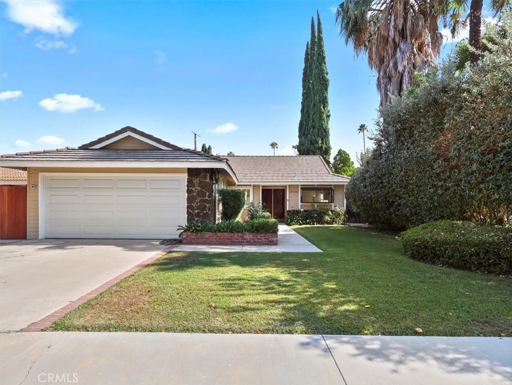 Beautiful and charming home on tree lined cul-de-sac. Fresh paint newer landscaping. Clean and sparkling for a new tenant. 3 spacious bedrooms with ample mirrored closets including master with private bath and dressing area. Formal Dining room, dramatic step-down Living room with fireplace. Den with wet bar (could be fourth Bedroom). Plus, an extra-large bonus room, ideal playroom or Family room. (unpermitted approx. 287 sq. ft. bonus room is included in the 2142 St. ft. (re appraiser). Spacious kitchen with breakfast area, large garden window above the sink w/view of front yard. Ample cabinets and pantry, stove, dishwasher and refrigerator. Crown molding, recessed lights, and marble, tile, and wood laminate floors throughout. Back yard has large patio and in ground Hot Tub plus trees and plantings for an ideal tranquil setting. Oversized 2 car garage. Ideally located to both Northridge Shopping Center and Warner Center. A Must See.