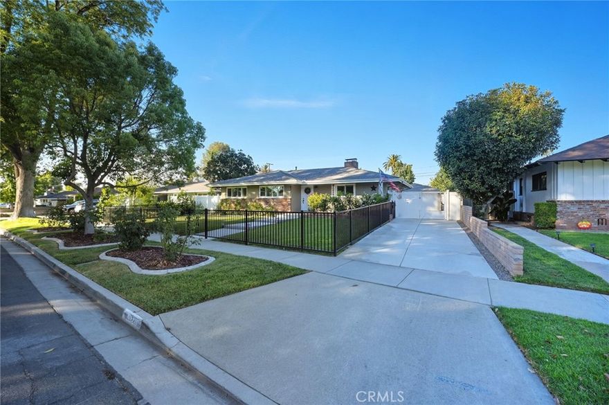 |WOOD STREETS| This beautifully remodeled 3-bedroom, 2-bath mid-century ranch is located on a tree-lined street in Riverside’s highly desirable Wood Streets neighborhood. Offering just under 1,500 sqft of living space on a large 9,147 sqft lot, the home has been extensively updated with nearly $300,000 in improvements—including a new 50-year roof, rain gutters, upgraded electrical panel, PEX plumbing, new sewer line, driveway, pool, patio cover, HVAC, insulation (attic and exterior walls), waterproof flooring, plantation shutters and windows, and fresh paint inside and out. The reimagined open-concept layout includes a fully redesigned kitchen, dining room, and bathrooms, while the spacious primary suite features direct access to a private above-ground spa under the covered patio. The backyard is an entertainer’s dream with a beach-entry pool, tranquil water feature, low-maintenance turf, and a removable safety pool fence. A detached garage offers potential for ADU conversion, and there’s room for RV parking as well. Vinyl fencing in the back and wrought iron fencing in the front add privacy and secure areas for the kids and pets. Located just minutes from Riverside City College, the historic Mission Inn Resort & Spa, and vibrant downtown Riverside, this move-in-ready gem sits in a festive, family-friendly neighborhood known for 4th of July fireworks show and Halloween celebrations. Literally, nothing left to do—just move in and enjoy your new lifestyle on Beechwood Place.