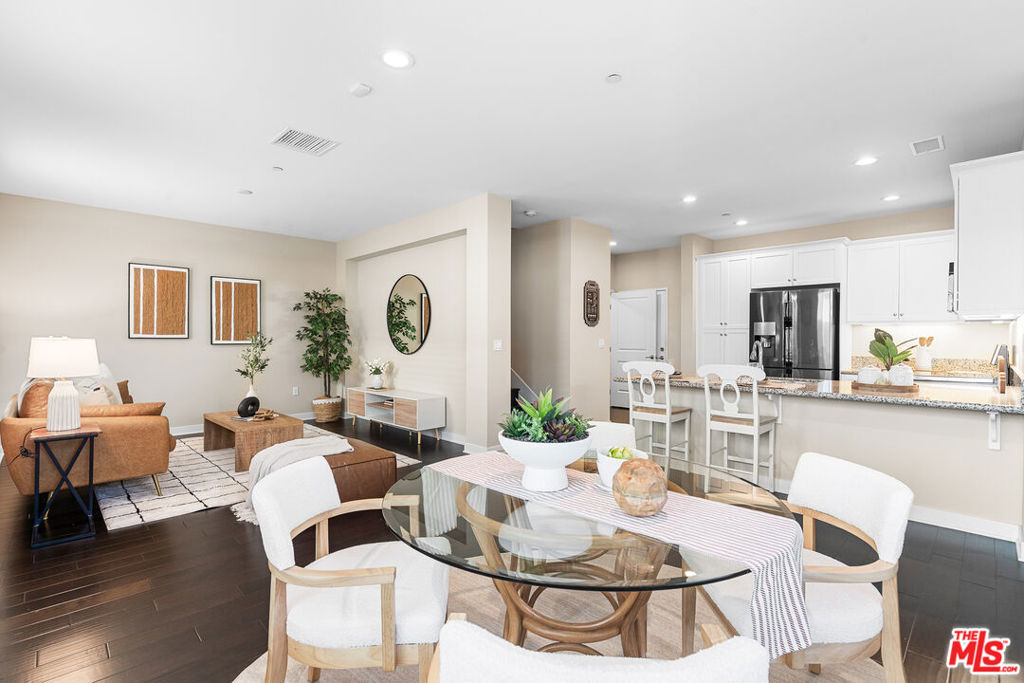 Rare 2-Story End-Unit Townhome! Built in 2016, this beautiful home features 3 bedrooms and 3 bathrooms with an open-concept layout perfect for modern living. The upstairs living area offers extra space for a family room, office, or play area. The primary suite includes two walk-in closets for added comfort and convenience. Enjoy direct access from the attached garage leading into the kitchen. Located in a desirable community with a pool, playground, and park, and just minutes from The Source, Buena Park Downtown, Disneyland, and major freeways for easy access to shopping, dining, and entertainment.