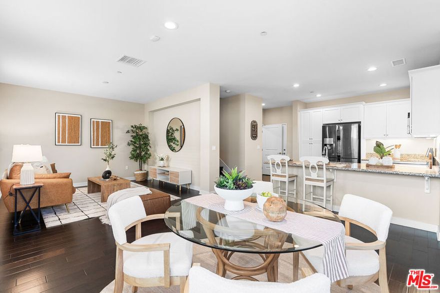 Rare 2-Story End-Unit Townhome! Built in 2016, this beautiful home features 3 bedrooms and 3 bathrooms with an open-concept layout perfect for modern living. The upstairs living area offers extra space for a family room, office, or play area. The primary suite includes two walk-in closets for added comfort and convenience. Enjoy direct access from the attached garage leading into the kitchen. Located in a desirable community with a pool, playground, and park, and just minutes from The Source, Buena Park Downtown, Disneyland, and major freeways for easy access to shopping, dining, and entertainment.