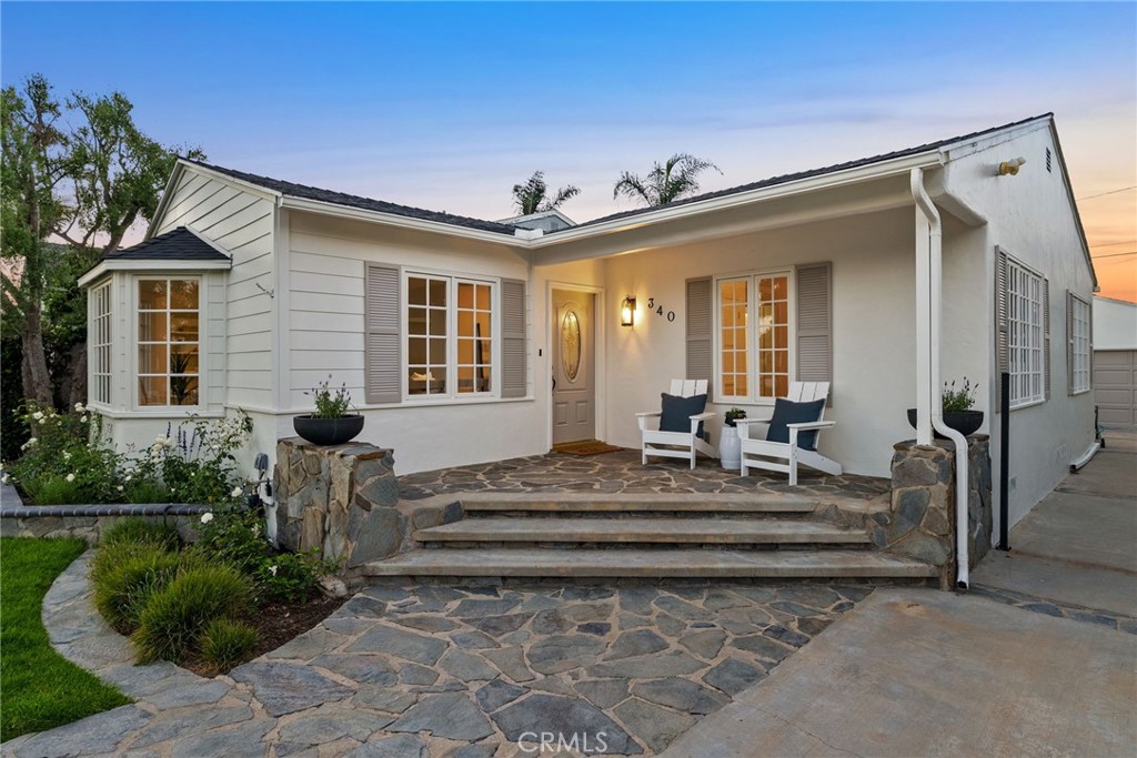 Welcome to 340 Broadway, a beautifully updated 3 bed, 1.5 bath cottage nestled on a spacious 6,628 sqft lot in one of Costa Mesa’s most desirable neighborhoods. Located within the sought-after Mariners Elementary district, this 1,268 sqft home blends timeless character with modern sophistication. Natural light floods the interior, highlighting the new wide-plank vinyl floors, fresh paint, and stylish brass hardware throughout. The inviting living room features a cozy bay window with a custom upholstered cushion and a wood-burning fireplace adorned with a striking marble surround. The kitchen is a showstopper, completely remodeled with custom cabinetry, marble slab countertops, farmhouse sink, designer tile backsplash, and a full suite of top-of-the-line Thermador appliances, including a commercial six-burner dual-fuel range and a Subzero refrigerator. Both bathrooms have been thoughtfully redone, featuring custom vanities, marble surfaces, gold hardware, and designer fixtures. The full bath includes a soaking tub, a custom-tiled shower with handheld feature, and a stone tile floor for a spa-like feel. Outside, enjoy newly landscaped front and back yards, fresh paint, charming new shutters and lighting, and recently planted sycamore trees that will grow into a canopy of shade. The garage includes a new epoxy floor, newer washer and dryer, and updated opener. This turnkey cottage is the perfect blend of curb appeal, thoughtful upgrades, and coastal charm—all within minutes of Newport Beach, 17th Street, and award-winning schools.