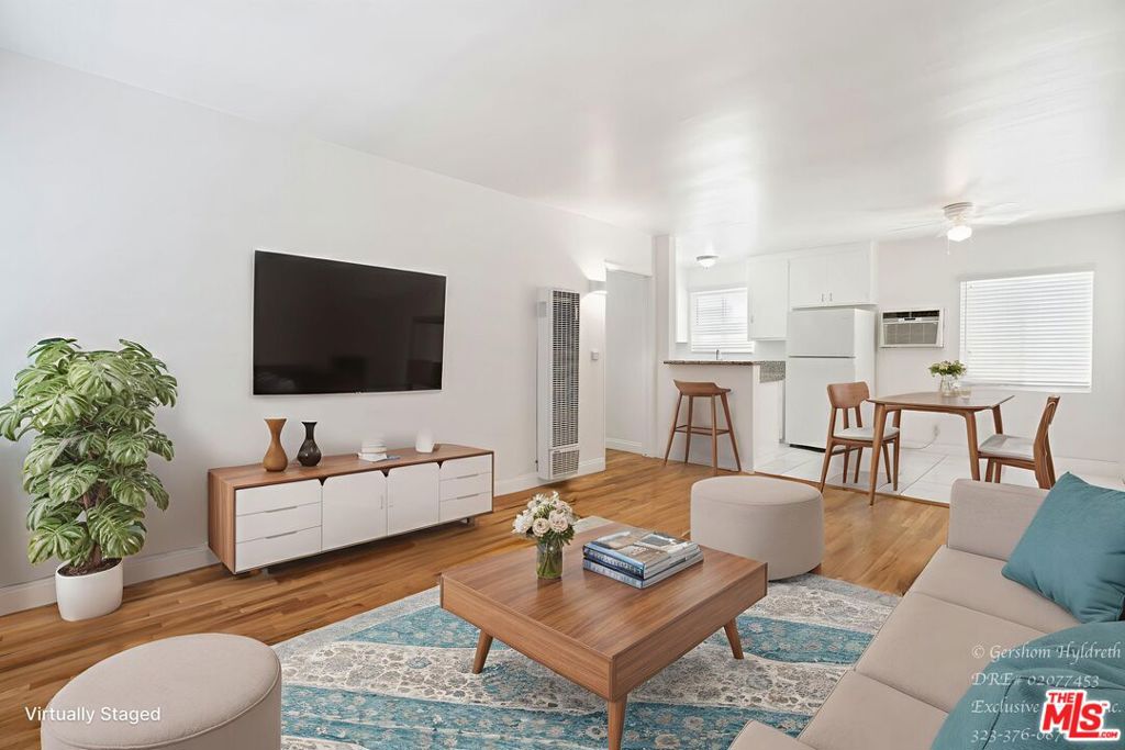 This cozy yet spacious apartment blends classic touches with modern updates. With real wood and tile flooring throughout, plenty of natural light, and a open layout, it's perfect for comfortable living. Includes 1 parking space, outdoor storage, and on-site laundry. Open-concept kitchen with sparkling granite countertops, refrigerator & stove. Real wood floors in living areas + tile in kitchen/bathroom. Updated lighting fixtures & large windows for a bright, airy feel. Wall-mounted AC + gas wall heater for year-round comfort. Spacious bathroom with pedestal sink, bath/shower & modern lighting. Large mirrored closet plus extra cabinet storage. 1 parking space included + outdoor storage. Community laundry room with coin & coin-less options. Available now make this charming space your new home!
