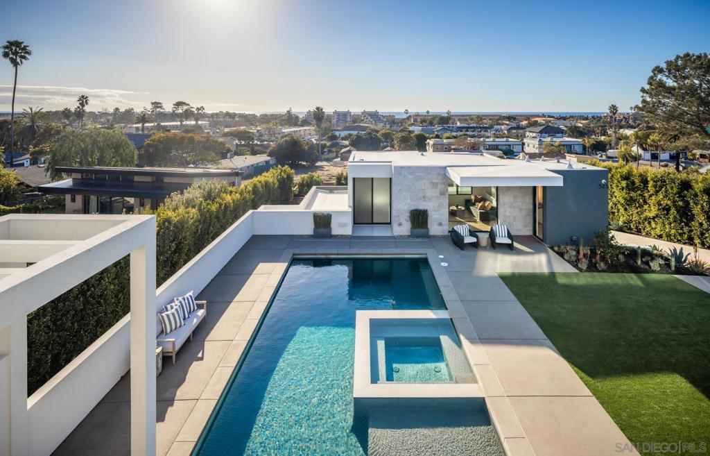 Welcome to 521 - 523 S Rios, stunning newly built 2023 ocean-view home with $2 Million of owner upgrades in 2024. This home is just steps from Cedros Design District in the heart of coastal Solana Beach; offering amazing world class restaurants and nightlife just 3 minutes away by foot. This home is a short walk to the Del Mar Fairgrounds & Racetrack and the stunning beaches and dog beaches of Del Mar & Solana Beach. Designed by EOS Architecture and developed by RMCI Group this contemporary compound is a total of 6,731 square feet with a luxurious 7 bedroom/10 bath main house (6,206 sq. Ft., including a detached guesthouse/ADU with 1 bedroom/1 bathroom (525 sq. ft.). This home features sophisticated architectural details, including a teak pivot door, soaring 11-foot ceiling enhanced by Kuzco and Fifth Avenue light fixtures, floating glass stairs, stone columns and walls, French oak-gray washed wood floors and a Lutron lighting system designed to create the perfect ambiance. Awake sliding glass doors seamlessly connect the indoor living spaces to the outdoor oasis complete with a 40-foot pool, 10x10 spa, an outdoor kitchen, dining and bar seating, a fire pit, acid-etched concrete patios and multiple lounge areas - creating an atmosphere reminiscent of a high-end luxury resort. The gourmet kitchen is equipped with top-of-the-line appliances including a Sub-Zero refrigerator, second Sub Zero refrigerator for the butlers pantry and wine fridge, Gaggenau 6-burner induction gas cooktop, Wolf microwave drawer, two Miele dishwashers and a spacious Butler’s pantry. The Primary Suite welcomes you with sweeping ocean views from its private deck, a gas fireplace with porcelain slab surround, dual custom walk-in closets, a Sub-Zero refrigerator with custom cabinetry, a coffee bar and electric sun shades. The luxurious master bath features porcelain tile floors, a spacious shower with rain shower heads and a soaking tub. The guesthouse/ADU boasts a flexible layout complete with a wet bar and direct access to the outdoor living space and fire pit, maintaining the same design aesthetic and luxurious feel found throughout the rest of the home. Newly built in 2023 the home has also been completely customized in 2024 with a number of state of the art features including a Savant system that integrates a full security protocol with 360 degree cameras & 24/7 surveillance, automatic & remote access blinds throughout the entire home and mobile door locking. Brand new upgrades include 25 foot tall Indian Laurel hedges around the north-western perimeter, a wellness circuit with Clearlight 3-person cedar-lined dry sauna, Breathe Degrees Cold Plunge with 36 Degree chiller and Redwood enclosed surf shower. The Seller installed new Toto toilets with Washlets, new TVs throughout the home, mobile access to HVAC through the Savant system and a new Kitchen in the first floor bedroom perfect and convenient for family or as caretaker quarters. Additionally, recent installations include a whole house PurEarthH2O water softening and reverse osmosis system and 3 location drinking water faucets. EOS Designed, RMCI built and further customized throughout all of last year; this home is packed with value and as impressive as you will ever see alongside the ocean here in Solana Beach!