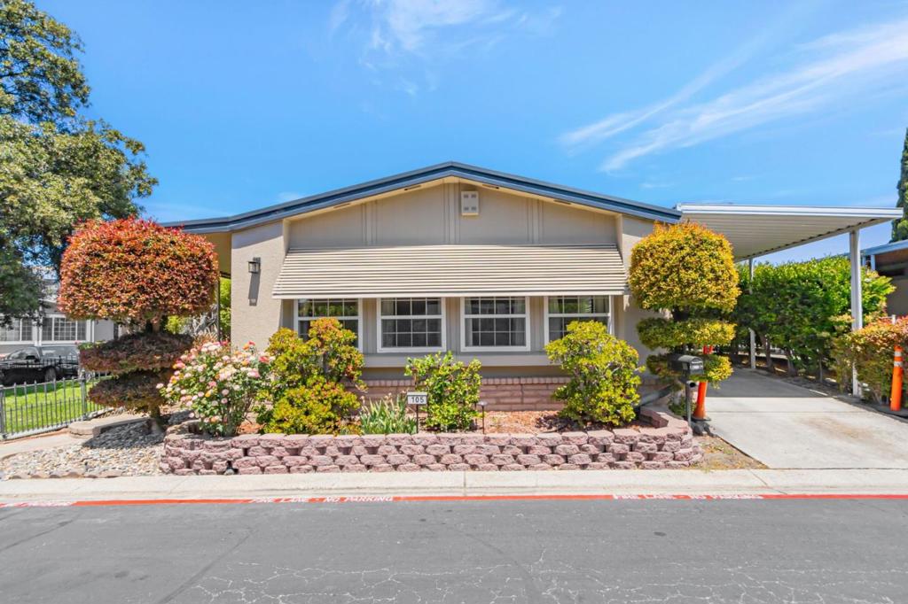 Located in the desirable Oakcrest Estates community in North San Jose, this well-maintained mobile home offers a rare combination of comfort, location, and lifestyle. Step inside to discover an inviting living space designed to balance functionality and comfort. Natural light fills the interior, creating a warm and welcoming atmosphere, but the real highlight lies just outside: an expansive yard with lush green grass, perfect for enjoying the outdoors in your own peaceful retreat. In an area where outdoor space is limited, this generous yard is a true feature. Oakcrest Estates is a gated, family-oriented, and pet-friendly community ideal for those who want a home that accommodates every member of the household, including the four-legged ones. The community is clean, quiet, and well-managed, offering a serene environment in a prime location. This home, ideally situated between San Jose, Sunnyvale, and Milpitas, places you right in the center of it all with quick access to major tech hubs, public transportation, shopping centers, restaurants, top-rated schools, and major highways just seconds away, making commuting a breeze. The generous carport can accommodate up to 3 cars. If you're searching for a comfortable, well-maintained home with a large yard, this gem is the perfect fit.