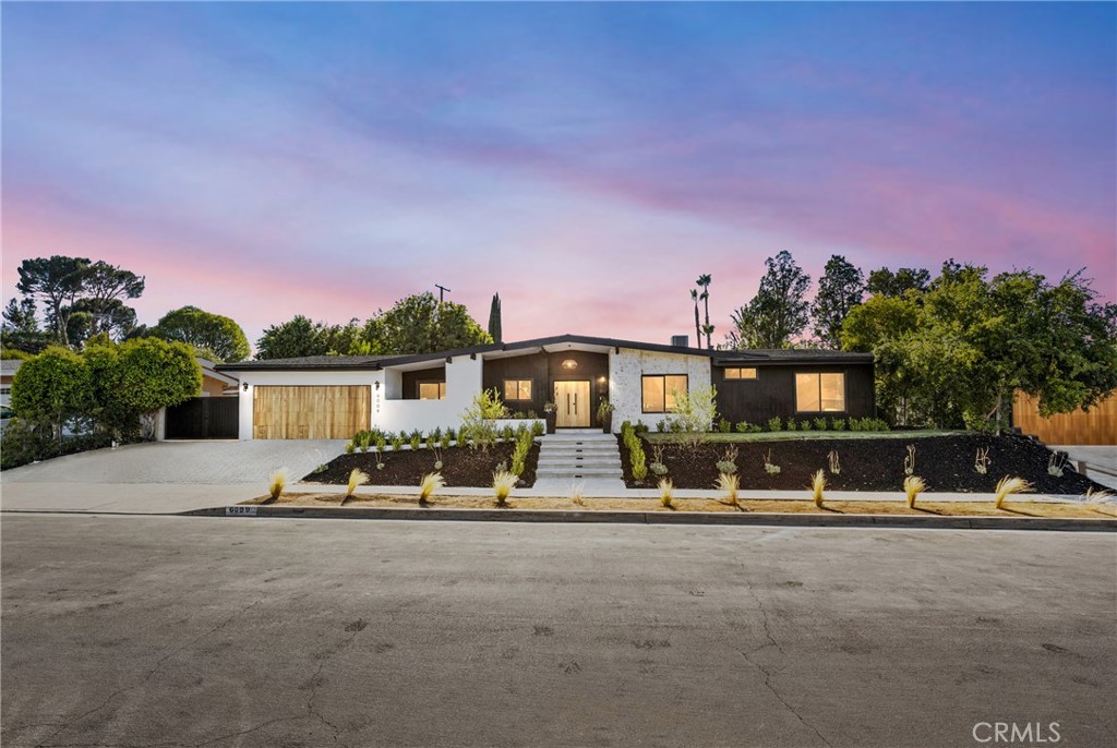 Nestled on a tranquil tree-lined Street, this masterfully restored, single-story Charles Dubois home offers an unparalleled living experience. Located in one of the most highly desirable Woodland Hills neighborhoods of Woodland Hills , you'll enjoy close proximity to award-winning schools, exceptional shopping and entertainment at The Village, The Commons in Calabasas, and some of the best restaurants around. From the graceful entry adorned with mature trees to the alluring zen-like yard with Mountain Views this home embodies true California living. With an extensive high-end renovation in 2025, this residence has been carefully restored and transformed into a chic and stylish showstopper with Lots of Curb appeal, Privacy Double Gated Side Entry can be used for RV / Auto parking seamlessly blending Modern design with modern comforts. Upon entering, you are greeted with the interior Foyer living area featuring Open Spacious Floor plan and a cozy Art piece Mid Century Modern fireplace, and an amazing view of the lush front yard with its brand new, New pool /Spa / Baha and Lounge area
perfect for year-round entertaining. The interior is thoughtfully arranged with open living and dining spaces in mind. The newly remodeled kitchen, complete with European-style custom wood cabinets and a stunning center island Chefs Kitchen provides the perfect setting for entertaining. Adjacent to the kitchen is an expansive dining room with a fireplace, large windows, and sliding doors that lead to the breathtaking backyard oasis. This home also features a large family room and Custom Wine room area holding up to 52 bottle creating an ideal space for casual gatherings. The Living and Dining rooms open directly to the backyard, enhancing the indoor-outdoor flow. In the backyard, you'll
find a custom-built Large Patio with a dining area inside, perfect for alfresco meals. The backyard also boasts a Large freshly laid Sod Grassy yard with ample space for relaxation or entertaining. There are four bedrooms with on suites for each bedroom including the primary suite, which features an exquisite bath, custom tiles and a custom built walk-in His/ Hers closets and and Sliding door that open to the Pool & Lounge area and enjoy a great view of the gorgeous pool & Mountains views Tranquil and very private backyard with custom barbecue and entertainment area. Dont miss your Chance to make it yours!