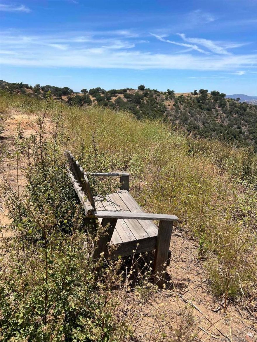 The most amazing natural mountainous setting with expansive, breathtaking views. Over 8 acres ready to build or hold for long term appreciation. Set in private gated community with paved roads, at the end of a cul-de-sac street. Already has utilities in place, well on site, plans approved for septic, partial pad has been cut. Most of the heavy lifting has already been done.  Wildlife abounds, yet only 5 miles from downtown Julian.