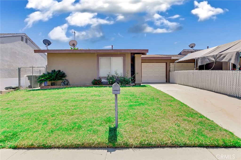 No HOA, on a large lot. Adorable single story, 2 bedroom, 1 bath home. Spacious living room with high ceilings and a sliding door leading to the backyard. Kitchen and dining area with sliding door leading to a covered concrete patio. Two spacious bedrooms and a full bathroom. Other amenities are 1 car attached garage, covered concrete patio, spacious backyard fully fenced with a slight view of the mountains and laundry in garage. Close to schools, shops, restaurants, golf courses, entertainment, freeways, 60, 91 and 15. No HOA