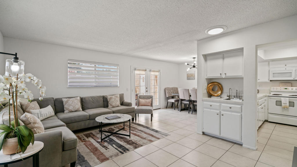 This charming condominium is located in a picturesque gated community. Features three bedrooms and two bathrooms. The living room displays a gorgeous view of the surrounding mountains. This end unit has green belts and is a perfect space for quiet, comfortable living. Just steps away from the community pool. It also offers an enclosed private patio with access to two assigned parking spaces. Remodeled master bathrooms with dual sinks and a shower. The condo is being offered furnished, including a refrigerator, washer, and dryer. The community holds many possibilities in terms of fun activities. It provides multiple pools with spas and tennis courts for the active person. For those who prefer more luxurious options, this condo is near the restaurants, stores, and a movie theater in The River outdoor mall. This is the perfect place to call home!