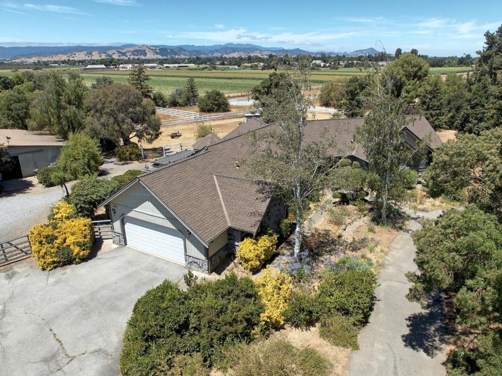 At approximately 2,470 square feet, this four-bedroom, three-bathroom single-level home is situated on approximately 2 1/2 flat, usable acres set well back from any major road. It sits in a peaceful location and is accessible from three sides. The property features a five-stall barn with a tack room and wash area, as well as an additional detached building that can be used as a hay barn or additional garage. An arena and round pen, as well as a dog run, are adjacent to the barn. The property is fenced and cross-fenced The home has a private well and septic system, as well as owned solar, providing self-sufficiency. The single-level layout features a great room, and the kitchen and family room have been updated with newly installed luxury vinyl plank flooring. The open family room and kitchen offer ample counter space for cooking and entertaining, while the separate great room and dining area boast soaring ceilings and a cozy fireplace. Conveniently located minutes from town and Harvey Bear Ranch County Park, the property also sits within the Santa Clara County Wine Trail. If privacy, convenience, and a little bit of country are what you are looking for, then Welcome Home to 2000 Oscar Court.