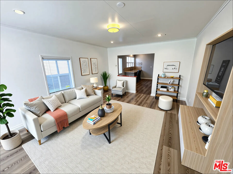 Welcome to this bright and inviting 2-bedroom, 1-bathroom home featuring renovated floors throughout. The sun-filled living room flows seamlessly into the kitchen, creating a warm and open feel. A long gated driveway and 2-car garage offer abundant parking, with an additional storage room behind the garage. Recent upgrades include a new roof, new AC & heat, fresh paint and updated electrical. Conveniently located near the beach, Playa Vista, Marina & Culver City businesses, restaurants, shopping and major freeways, perfect for easy coastal living. Photos are virtually staged. To be sold As is.