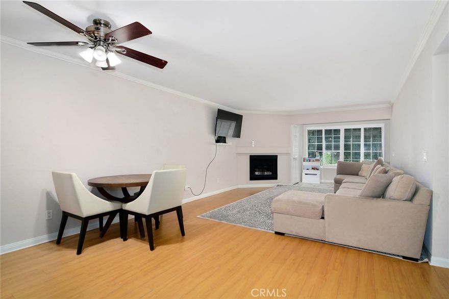 Resort style living in the heart of Warner Center, welcome to The Met! Immaculate 2 Bed + 2 Bath condo located on the 1st floor of building #3. Turn key unit tucked away at the back of the building, walking distance to the main pool, gym & tennis courts. Certainly the most desirable floor plan, this style utilizes an open concept with a guest bedroom and full bath up front, while the master sits at the back of the unit with views of the exterior! The master bedroom also offers a luxurious en suite bathroom featuring double vanity sinks in addition to an enormous closet. This spacious and beautiful condo features such amenities as wood style flooring throughout (NO CARPET), gas fireplace, granite countertops & stainless steel appliances. Designated dining room for more formal eating yet with open views to the living area and outdoor space. The living room has been extended by the original builder to allow for a larger living area, while still providing inspiring views of the rear grounds. Last but not least, your very own WASHER & DRYER IN THE UNIT + 2 COVERED parking spaces in the garage below!!! The Met is a guard gated community that offers 4 resort-style swimming pools, six night lighted tennis courts, full fitness center, racquetball, indoor basketball court, multiple spas & 24 hour guard gated security. All this located within walking distance to The Village, Warner Center Park and all the dining, shopping & entertainment Warner Center has to offer.