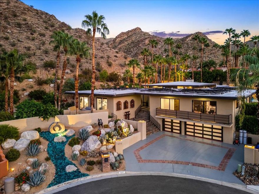 An architectural statement in the coveted Andreas Hills of South Palm Springs, this 6,252 sq. ft. custom contemporary showcases bold design, privacy, and effortless desert living. Perched on a quiet cul-de-sac on fee land (you own it!), the home captures dramatic mountain views and a seamless connection between indoor and outdoor spaces.Expansive walls of glass draw the eye to the resort-style backyard complete with a newly resurfaced pool and spa, rock wall water feature, and mini-golf area that brings playfulness to the sophisticated design. Enjoy gatherings under the covered lounge with misting system, knowing the home is powered by paid solar and supported by a natural gas backup generator for comfort and efficiency.Inside, soaring ceilings and open living areas create volume and flow, while the chef's kitchen impresses with a massive island, generous counter space, and effortless connection to the great room. The home offers 5 bedrooms, 4 full baths plus a powder room, and a 3-car garage, balancing luxury with everyday practicality.Additional features include a media room wired for projection and surround sound, a dedicated gym, and freshly painted interiors ready for your personal touch. A recent pre-listing inspection with repairs completed ensures peace of mind and immediate enjoyment.This is a rare opportunity to own a modern architectural retreat in one of South Palm Springs' most sought-after neighborhoods where style, serenity, and sophistication come together under one roof.