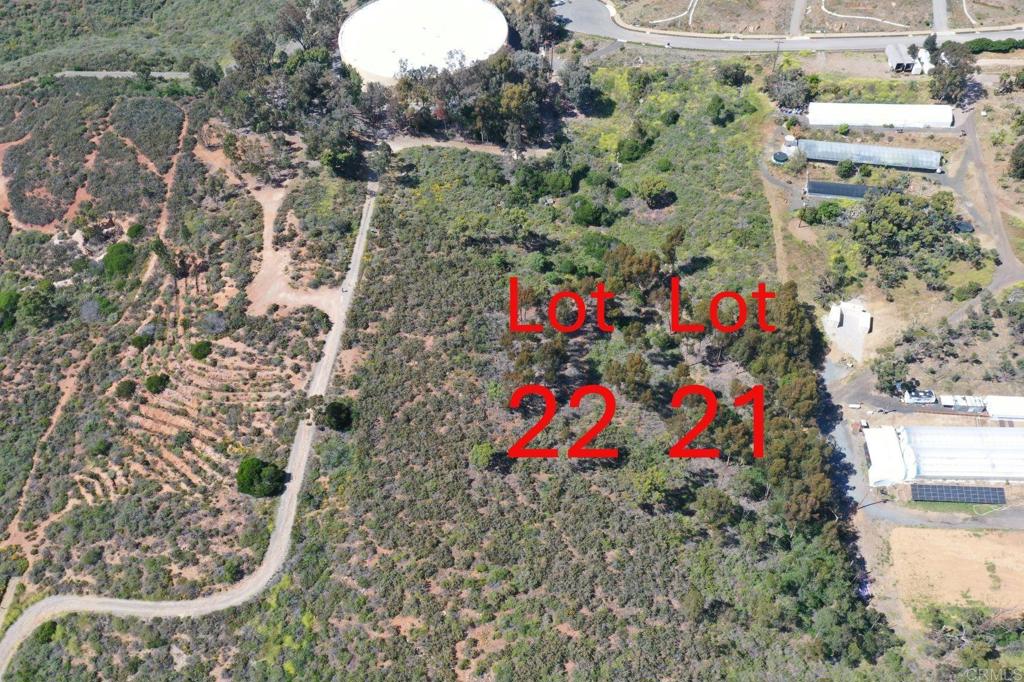 Prime 2.45-acre lot with mountain views and ocean breezes, surrounded by luxury homes in Knightsbridge and Shea Homes One. Adjacent 2.46 acre parcel also for sale—buy both for 4.9 acres total. Ideal for land banking until the access road via legal easement from Lone Hill is completed. Although your access is through Knightsbridge, neither of these lots is subject to the HOA. Both lots are located in the City of Encinitas—A rare opportunity to live in the County! Information on the adjacent lot is also provided for those who are interested in both.
