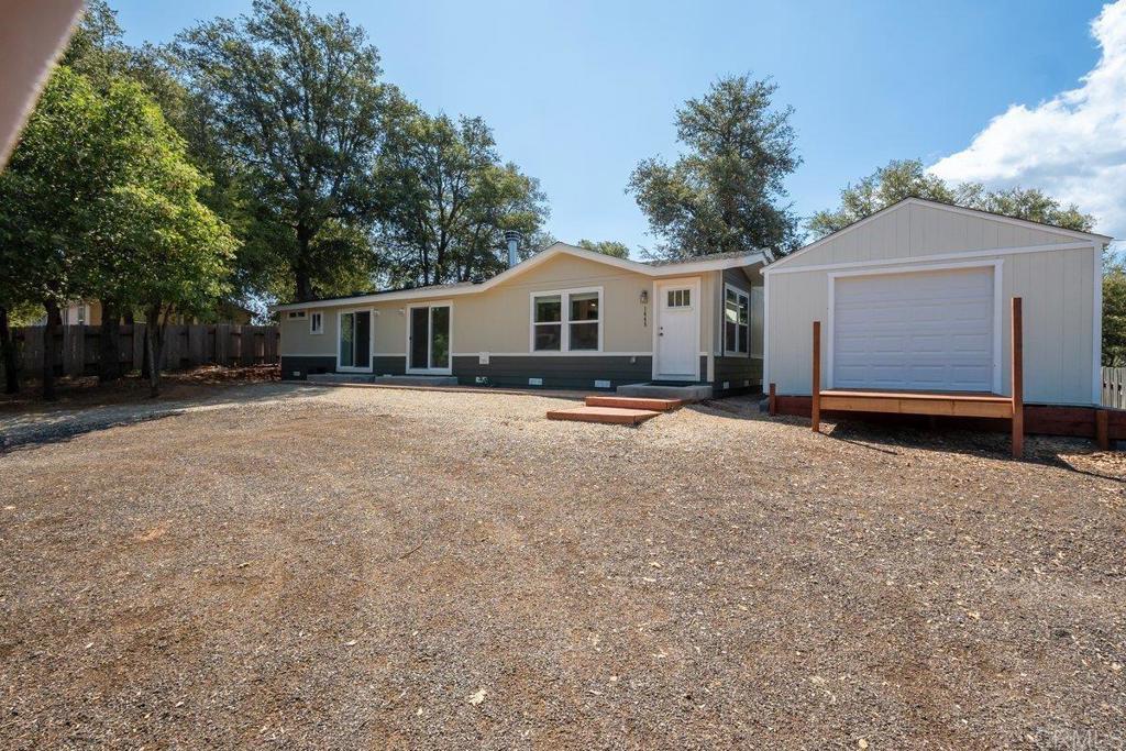 Gorgeous 2022 built home nestled in the stunning Pine Hills neighborhood on the west side of Julian. Tucked away on quiet road you will find breathtaking panoramic views from this meticulously maintained property overlooking William Heise Park and the Cuyamaca Mountains. Property sits on over 1/2 acre usable lot and features 1325 square feet turn-key home with 2 bedrooms+office/bonus room, 2 full baths, plus laundry/mud room. Open concept floor plan with large dual pane windows, multiple sliding glass doors, and vaulted ceilings provide abundant natural light and spectacular views. Entire home features luxury vinyl plank flooring. Large living room with cozy fireplace flows into beautiful kitchen/dining area featuring stainless appliances, Corian countertops, tile backsplash and crisp white cabinets offer lots of storage. The primary suite features walk in closet and en suite bathroom with oversize tub and slider access to private back yard with panoramic views of the mountains. Large bonus room/office could easily be used as 3rd bedroom. Adjacent to house, a custom built workshop built in 2024 is perfect for craftsman/woodworking and hobby enthusiasts. An adorable additional "she-shed" was also installed providing additional storage/ hobby space. Gently rolling, usable lot features lovely mature oak trees and lots of shade. There is plenty of space for ADU, animals, gardening, etc.- the possibilities are endless. Just a short walk down to William Heise Park and multiple hiking trails and campground amenities. Just a short drive to charming downtown Julian where you will find lots of restaurants, boutiques, breweries, and local activities. Outdoor enthusiasts will love all the hiking, horseback riding, fishing, and boating opportunities in close proximity. Have the best of both worlds where you can experience peaceful country living in a fantastic mountain community while still being just 1 hour from downtown San Diego. Definitely a must see!