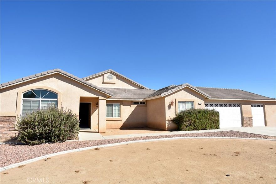 Welcome to your dream Home nestled within the highly sought-after community of The Vinyards! This spacious 5-bedroom, 3-bath residence offers a generous 2,570 m/l square feet of a nicely designed living space on almost a half acre of fenced land, in a cul-de-sac. Enjoy both formal and informal living and dining areas providing flexible spaces for hosting gatherings or comfortable daily living.  The kitchen offers granite counters and an island, ample storage. Five bedrooms include a convenient Jack 'n' Jill bathroom, ideal for family or guests. Other notable features include a cozy fireplace in the family room for those cooler evenings, access to patio and pool, an inside laundry room with storage and a specious three car garage, and a newer tankless water heater.  Other key features include a backyard with a magnificent inground pool and spa with salt water options, perfect for year-round enjoyment.  This property also caters to your adventurous side with dedicated RV parking and hool-ups. Located in a prime Apple Valley location, close to shopping, entertainment, medical facilities and much more, and offers everything you need for a premium High Desert lifestyle.