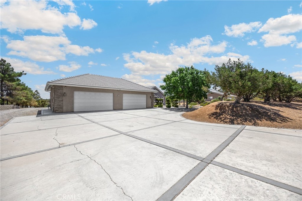 Value Range Pricing: $799k-849k. This stunning custom single-story home, designed by renowned architect Michael Wahob of Omega Designs, was thoughtfully crafted in 2001 with comfort, function, and quality in mind. Offering approximately 3,700 square feet of living space, the home features 4 spacious bedrooms + office/den/gym room and 3 bathrooms, all set on nearly 2 acres of land in the highly desirable Oak Hills area. Enjoy 9-foot ceilings throughout, with elegant tray ceilings lined with crown molding that elevate to nearly 10 feet, creating an airy and sophisticated feel. The huge entertaining kitchen features Corian counters, Viking 4 burner stove/oven with griddle, and stainless appliances. The large custom wood bar and adjacent wine room—lined with aromatic cedar wood—make entertaining effortless and impressive. Additional amenities include a central vacuum system, RV dump stations for both the house and the massive 4,400 square foot shop, and a 4-car garage with room for all your toys and tools. The shop includes its own bathroom and provides unparalleled space for off-road enthusiasts, hobbyists, or small business needs. Located 30 min from local ski resorts, a few miles to eateries, shopping entertainment, and FWY access. With room to roam, store, build a pool, or relax, this unique Oak Hills property delivers the ultimate in lifestyle flexibility and comfort.