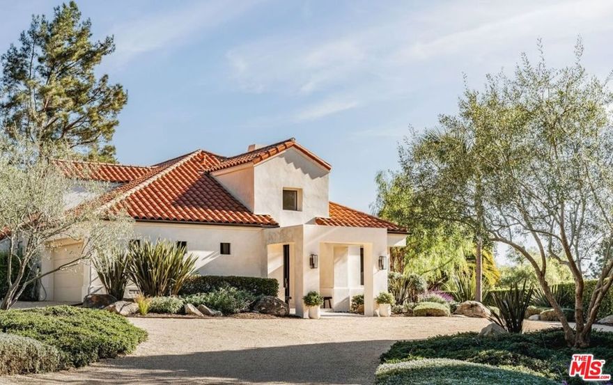Set on a private cul-de-sac, this 3-bed/2.5-bath home with 2 offices blends timeless Spanish architecture with Jenni Kayne-inspired interiors. Spanning 2,987 sq. ft. the Montecito home highlights soaring 19-foot ceilings, sunlit interiors, and an effortless indoor-outdoor connection. Two floor-to-ceiling stone fireplaces, natural oak floors, and open living, dining, and den areas add style and function. All bedrooms open to gardens, while the sanctuary-like primary suite features high ceilings, a spa-like bath, and 2 closets. A main-level office and upstairs office loft add flexibility. Outdoors, a large patio flows to a usable grassy yard with lush landscaping. Earthy and effortlessly luxurious, it's a rare find in the Cold Spring School District