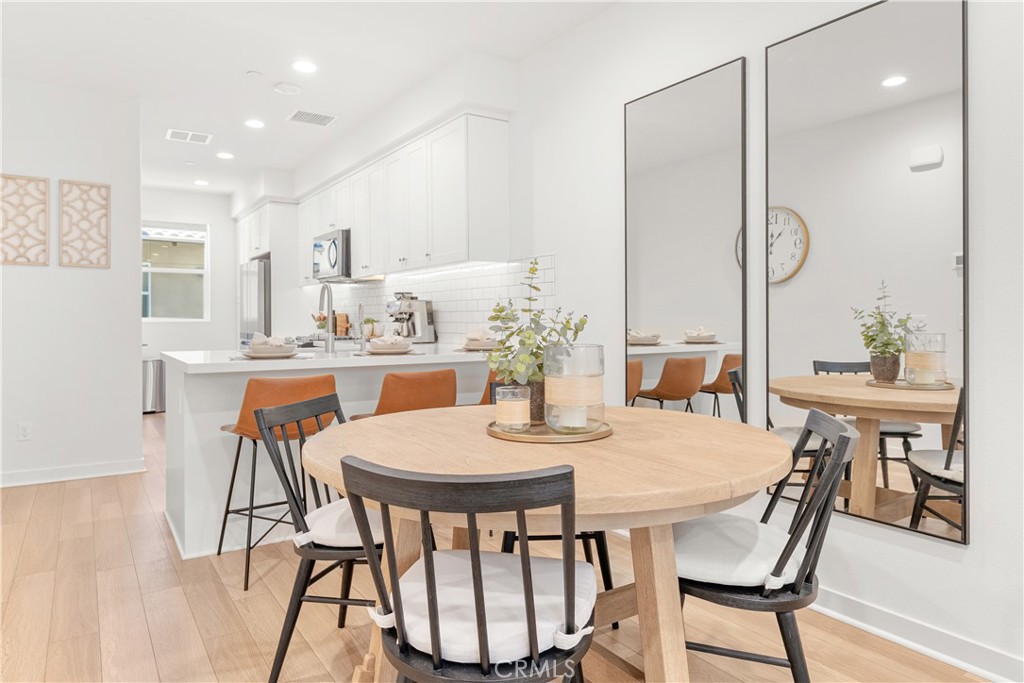 Here’s your moment to own a modern home in Neo Haven at Mission Foothills, a newer construction with no Mello Roos, low HOA dues, and the privacy of no neighbors above or below. A true standout in today’s market. Thoughtfully upgraded, this home offers 2 generous bedrooms, 2.5 bathrooms, and a two-car tandem garage with built-in storage, a tankless water heater, and fully paid solar. Inside, soaring ceilings and expansive windows fill the open layout with natural light. The sleek chef’s kitchen anchors the main level with quartz countertops, stainless steel appliances, and an easy flow to living and dining, perfect for everyday life and effortless entertaining. Smart living comes standard: Kwikset Smart Locks, Ring Doorbell, MyQ smart garage opener, an integrated Wi-Fi system, and MyHome lighting control. Additional upgrades include a premium whole-home water filtration system and stylish window treatments. Residents enjoy resort-style amenities: a sparkling pool and spa, two playgrounds, a cozy fire pit, and multiple barbecue stations with outdoor dining areas for year-round gatherings. Even better, the low HOA dues cover routine window cleaning and street sweeping for extra convenience and value. This home blends modern luxury with smart efficiency in a vibrant, amenity-rich community served by top-rated schools. Schedule your private tour today.