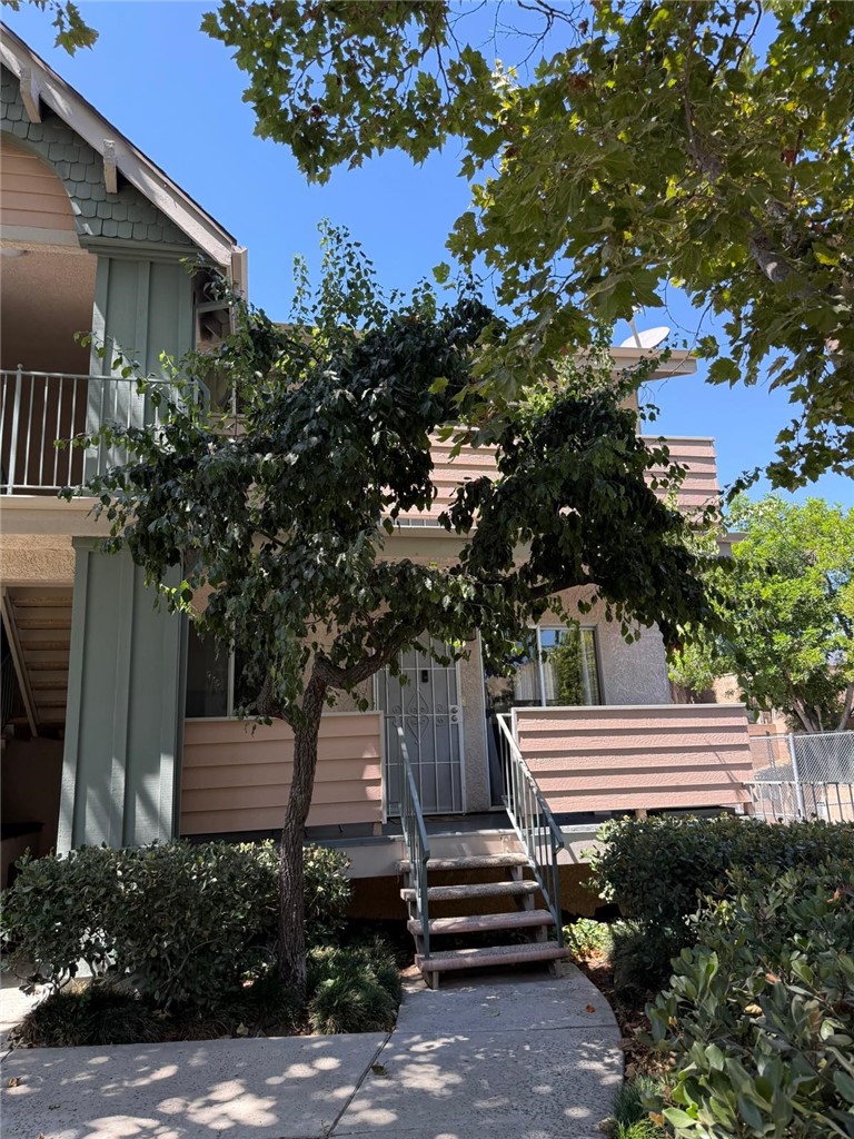 Welcome to Sylmar. Discover this charming 2-bedroom, 2-bathroom condominium nestled in a desirable gated community in Sylmar. This well kept upstairs unit is set towards the back of the complex, offering added privacy and a peaceful setting. The spacious open concept layout seamlessly connects the kitchen, dining, and living areas, while the private balcony provides a perfect spot to relax and enjoy the lush landscaping. The spacious primary bedroom includes its own en-suite bathroom with shower providing additional comfort. Parking is a breeze with direct access to a tandem 2-car garage plus an additional assigned space and nearby visitor parking. Community amenities include a sparkling pool and hot tub, basketball court, playground, and beautifully maintained green spaces for your enjoyment. Conveniently located, this home offers easy access to public transportation and major freeways (210, 5, and 118), making commuting simple. Shopping, dining, and grocery stores are just moments away, along with nearby parks, hiking trails, and schools adding to the convenience and lifestyle appeal of this wonderful home. Schedule your showing today!
