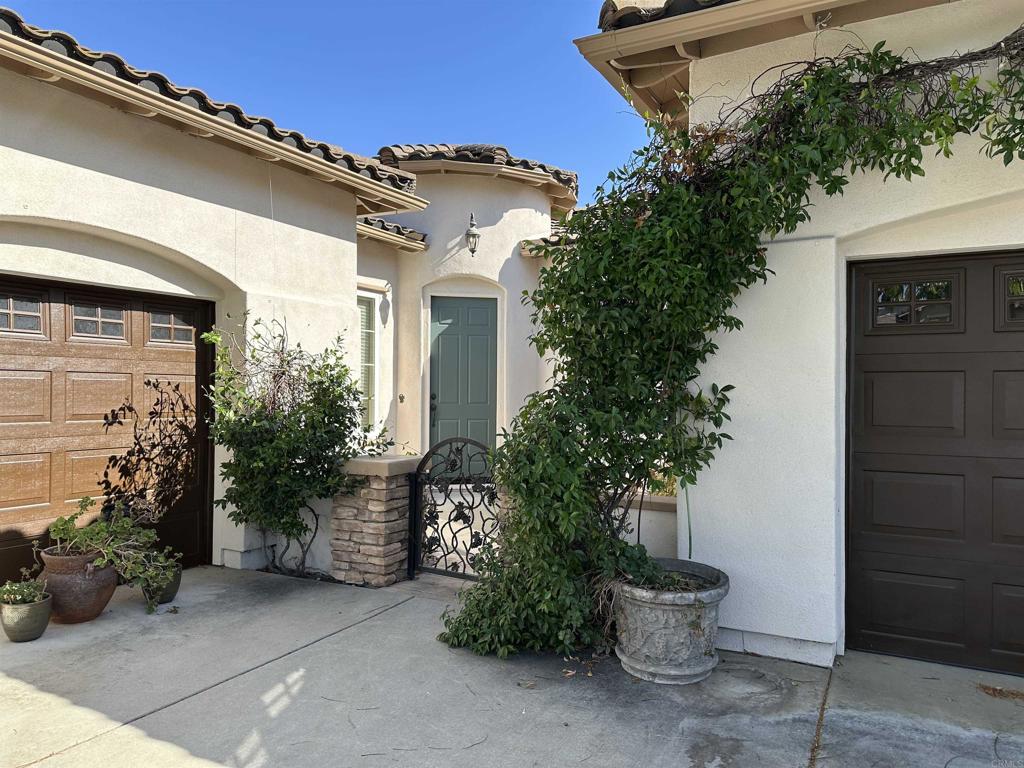 Located in a private gated community in Rolling Hills Ranch, this highly desired single story floor plan offers 3 bedrooms with an optional 4th in lieu of the den. Over 2600 square feet of sublime living space with formal living room, dining room and over sized family room with built in media niche, desk area, fireplace plus extensive cabinetry. Kitchen includes chef style double ovens, granite counters with center island, overlooking the family room. You will adore the high and coffered ceilings, custom floor to ceiling window treatments, executive size laundry room and 3 car garage. Primary suite includes a fireplace plus escape to the garden via the sliding door to the patio. The huge primary bathroom includes a oversized soaking tub, separate shower, massive walk in closet, dual vanities and a view to the garden that is unbelievable! Beautiful front and rear landscape with flowers galore, trellis covered dining space, raised dining slab with lemon tree and many gorgeous blooms to gaze at, lounge by, meditate with. True pride of ownership, original owner has lovingly cherished this cream puff of a beauty. Top rated schools, no mello taxes, low HOA. Community pool within walking distance has club house with grills and extras for friends and family. This home offers the perfect blend of comfort, style and community living.
