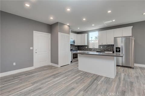 Photo of 3626 S Cimarron Street, Los Angeles, CA 90018 (MLS # SB26184802)