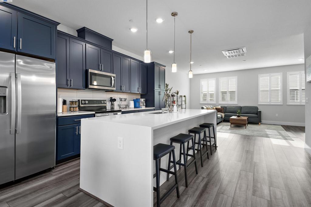 Compass Plan 7 at Bay37. A stunning 1,997 square foot townhouse-style condo bathed in modern upgrades (including OWNED solar system!) Boasting 3 bedrooms, 2.5 bathrooms, and a versatile flex room, it caters to every lifestyle. And wait, there's more! Spa-Worthy Master Bath: Indulge in a master retreat unlike any other. Heated Toilet Seats: Because luxury shouldn't stop at the doorway. Flex Room: This bonus space is your blank canvas! Craft your dream home office, art studio, or the ultimate relaxation zone. Side-by-side 2-car garage. A waterfall-edge kitchen island: Fit for a culinary king or queen, this island is the perfect spot to whip up masterpieces. Extensive Upgrades Throughout: Forget builder-grade beige! This condo is decked out with all the latest and greatest. From top-of-the-line finishes to designer touches, every detail is meticulously crafted. Location, Location, Location! This gem sits nestled in a vibrant community, offering - Easy access to Everything: Live close to the action without sacrificing peace and quiet. Walking distance to waterfront Bohol Circle Immigrant Park and Alameda Landing Shopping: Enjoy the convenience of having everything you need right at your fingertips. Ditch the ordinary and embrace an unparalleled living experience!
