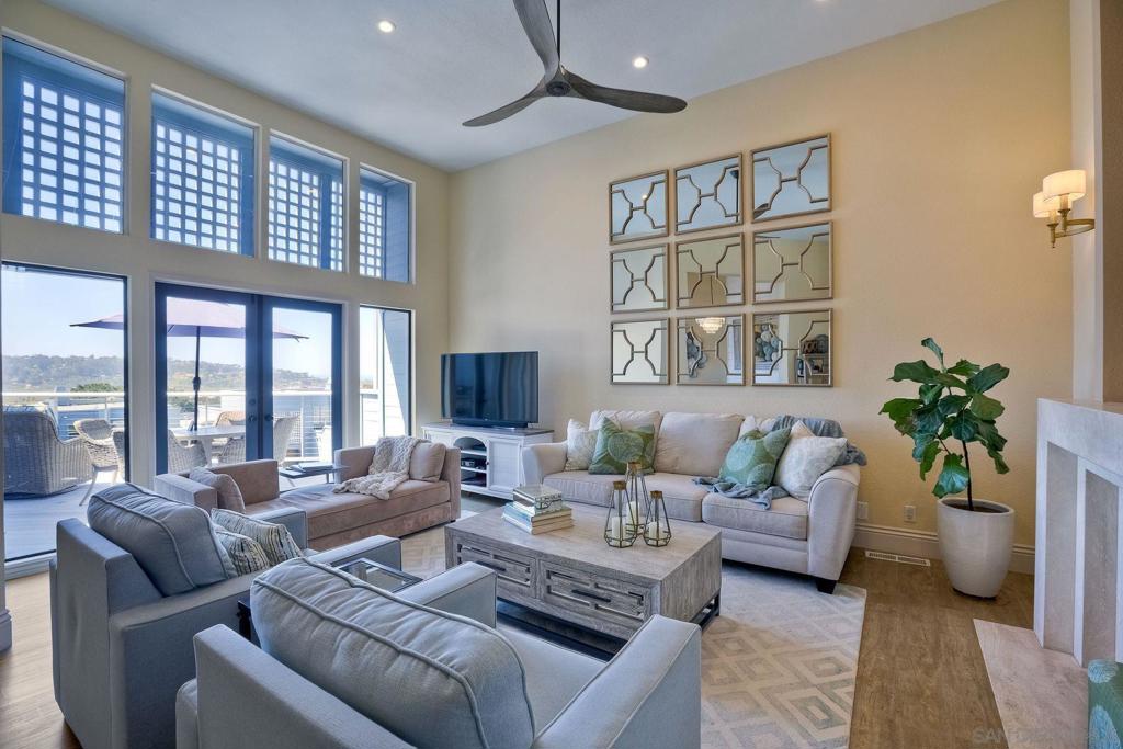 Experience the breathtaking beauty of the Pacific Ocean and the Del Mar Racetrack from this stunning SPindrift ocean view condo. Located above the Flowerhill Mall, this fabulous property boasts panoramic views of the estuary and racetrack, providing the perfect backdrop for your dream lifestyle. The fresh open feel of this beautiful condo is enhanced by high ceilings and a large deck facing south and west, accessed by sliding glass doors from the living room, dining room, and kitchen. Downstairs, you will find the bedrooms, each with private patio access, providing a serene retreat for rest and relaxation. Featuring plantation shutters and lovely stone countertops throughout, this upgraded property has white cabinetry and paint, lending a fresh and clean feel to the living space. The community has recently renovated the exterior, ensuring that this stunning property is as beautiful on the outside as it is on the inside. Take advantage of the amenities this community has to offer, including a pool and spa just down the street. Come experience the perfect combination of luxury, tranquility, and convenience in this exquisite SPindrift ocean view condo. Don't miss out on the opportunity to make this stunning property your own. Contact us today to schedule a viewing!