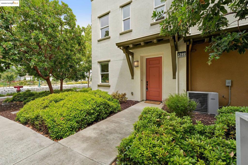 Welcome to this beautifully maintained single-level corner unit, featuring 2 bedrooms, 2 bathrooms, and an open, thoughtfully designed floor plan. With no steps at entry and a 2-car tandem garage, this home offers both comfort and accessibility. The open-concept kitchen includes a center island with a breakfast bar, perfect for casual dining, morning coffee, or entertaining guests. The spacious primary suite features an en-suite bath and a generous walk-in closet, while the second bedroom is ideal for guests or a home office, with a full bath adjacent to it. A convenient in-unit laundry closet adds to the ease of daily living. Enjoy unparalleled convenience—just steps from Target, Safeway, local restaurants, and Bohol Circle Immigrant Park. Commuters will appreciate excellent transportation options: bus to 12th Street BART, a free water taxi to Jack London Square, and nearby ferry terminals to San Francisco. Easy freeway access makes getting around the Bay Area a breeze. For outdoor and leisure enthusiasts, the nearby estuary and Alameda’s Spirits Alley offer a vibrant mix of breweries, wineries, and distilleries—all just minutes away. Don’t miss this exceptional opportunity to enjoy the best of Alameda living!