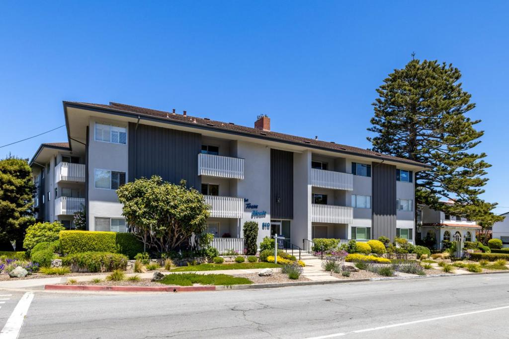 Welcome to this charming condo located in the heart of Pacific Grove. This residence offers 2 bedrooms and 2 full bathrooms, with a convenient ground floor layout. 400 square foot patio for dining and sitting, unique to and for exclusive use for this unit. Easy level access to laundry, parking and back gate. Most accommodating unit for dog or cat w/direct and level access to yard. Beautiful garden view. Unique location permits privacy from viewing by other units. The formal dining room is perfect for gatherings, while the family room features a cozy area for relaxing and entertaining. The kitchen is equipped with elegant granite countertops, providing both functionality and style. This home features beautiful hardwood flooring throughout, adding warmth and character to the living spaces. A fireplace serves as one of the heating sources, creating a cozy atmosphere during cooler months. For your laundry needs, just a few steps away, there is a utility room complete with a washer and dryer, with additional space for other essentials. In addition, there are three large storage spaces. With a lot size of 2,234 square feet and 1 garage space, this home offers both comfort and convenience in a prime location. HOA FEE INCLUDES, WATER, SEWER, GARBAGE AND GAS.