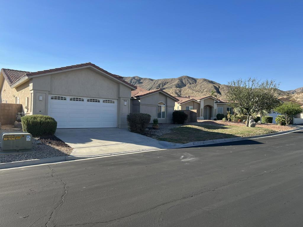 Welcome to your desert oasis in the sought-after 55+ gated community of Paradise Springs. This well-appointed 3-bedroom, 3-bath home offers 2,172 sq ft of open-concept living, perfect for both comfort and entertaining. Inside, you'll find arched doorways, a spacious granite kitchen with a breakfast bar, tile flooring in key areas, and formal and informal dining options. The primary suite and rear guest bedroom open to a large covered patio--ideal for relaxing or entertaining while enjoying stunning mountain views. Additional highlights include a walk-in closet, separate laundry room, ceiling fans throughout, dual A/C units for energy efficiency, and generous storage.Residents enjoy access to a resort-style clubhouse, sparkling pool and spa, and a putting green--all with low HOA fees.Don't miss the chance to make this Desert Hot Springs gem your next home!