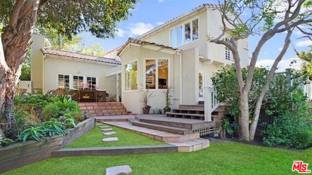 Spectacular gated blend of warm elegance and comfort custom built and designed home in Malibu's prestigious Point Dume. This gorgeous redone home has a light and bright entertainers floor plan with cathedral ceilings. There's a formal dining room with fireplace. Formal living room with high ceilings and Spanish tile along with views of the backyard. Chef's kitchen with top of the line appliances and breakfast area that looks out to a large backyard. Master suite has a Juliet balcony, cedar lined walk-in closet and master bath with high beamed ceilings and spa tub. The park like professionally landscaped backyard has two separate decks and a large grassy area with trees.