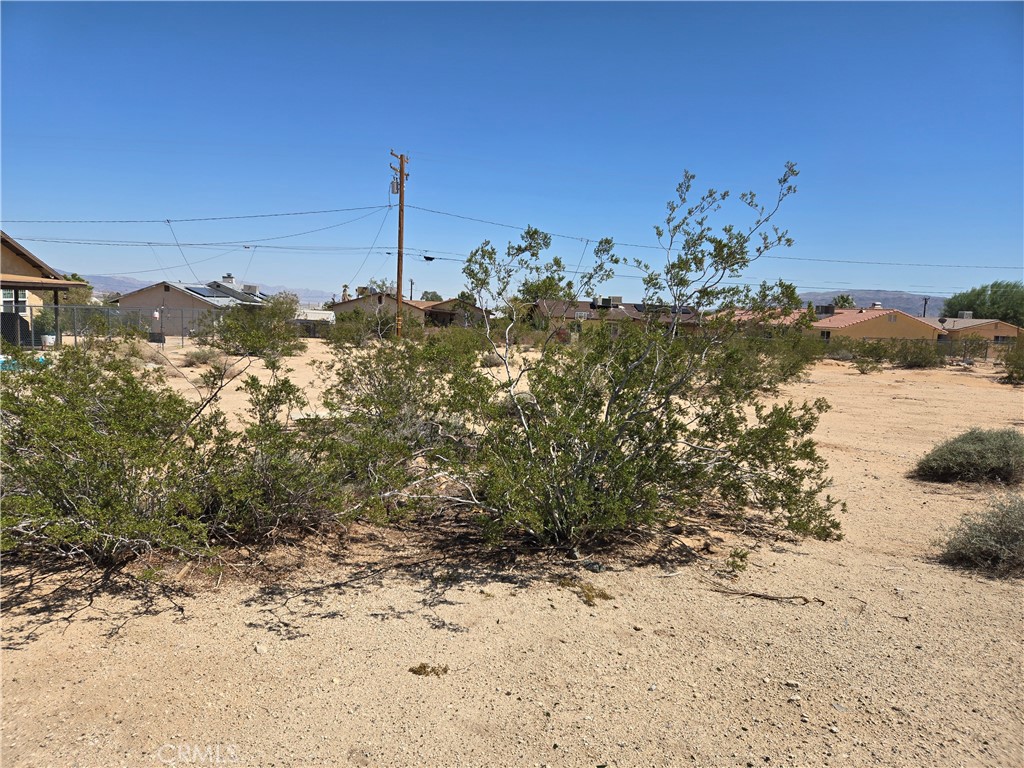 Build your dream in the heart of the high desert with this .2-acre residential lot in Twentynine Palms. Located just minutes from downtown and a short drive to the entrance of Joshua Tree National Park, this property offers both convenience and adventure. With utilities close by and easy access to local amenities, it's a rare opportunity to create a home or retreat surrounded by natural beauty and desert skies.