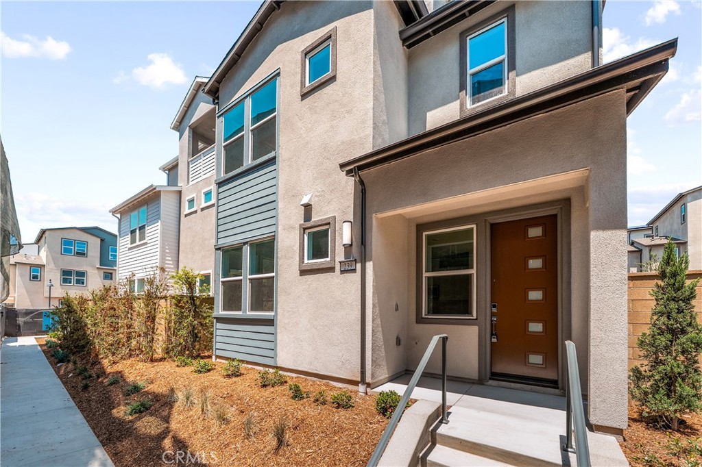 Located in the award-winning Irvine Unified School District, this beautifully upgraded 4-bedroom, 3.5-bath detached condo sits in the desirable Orion 2 community at Great Park.
This Plan 2 by Lennar offers a spacious, open-concept layout with high-end finishes throughout. The first floor features a stylish kitchen with quartz countertops, stainless steel appliances, a large center island, and is connected to bright living and dining areas that open to a private patio—ideal for entertaining.
The second floor includes a luxurious primary suite with a walk-in closet and dual-sink bathroom, plus two additional bedrooms, a full bath, and a separate laundry room. The third floor boasts a private bedroom suite with a full bath and additional outdoor space—perfect for guests or a home office.
Additional highlights include paid-off solar panels for energy efficiency and one year of HOA dues prepaid by the owner.
Residents enjoy access to Great Park’s resort-style amenities, including multiple pools, parks, sports courts, and more. Conveniently located near top-rated schools, shopping, dining, and major freeways.
Move-in ready and perfectly located—this is Irvine living at its best!