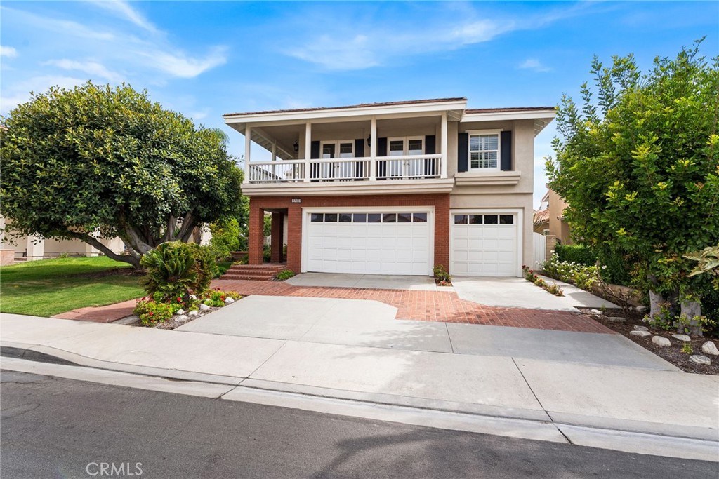 Luxury Live Auction! Bidding to start from $1,800,000! Welcome to 2201 Marselina—a stunning residence nestled on a peaceful interior lot in Tustin Ranch. This exceptional home is move-in ready and showcases four spacious bedrooms and three and a half baths, including a convenient main-level suite with its own private bathroom and an additional downstairs half bath. Step inside to soaring ceilings and abundant natural light that highlight the elegant Brazilian hardwood floors, fresh new carpet, interior paint, and a newly installed tankless water heater. The chef’s kitchen is beautifully appointed with granite countertops, stainless steel appliances, built-in SubZero refrigerator, Asko dishwasher, Frigidaire dual ovens and microwave, pull-out cabinetry, plantation shutters, and a cozy breakfast nook overlooking the lush backyard. Designed with entertaining in mind, the inviting family room offers a fireplace, wet bar, custom built-ins, and direct access to the backyard. Upstairs, the expansive primary suite features vaulted ceilings, a fireplace, generous seating area, dual vanities, soaking tub, walk-in shower, and a customized walk-in closet with built-ins.
The versatile bonus room, complete with wainscoting, built-in storage, and a private balcony, is perfectly situated next to the fourth bedroom—ideal for guests or multi-generational living. Step outside to a resort-style backyard showcasing a paver patio, gazebo, multiple lounging areas, and a fenced-in pool and spa with waterfall, new plaster, and a new heater.
Additional highlights include an indoor laundry room with sink and cabinetry, and a three-car garage with built-in cabinets and epoxy flooring—currently configured as a two-car garage with a fully finished office space in the third stall.
Located just moments from parks, award-winning schools, premier shopping and dining at The Market Place, and Tustin Ranch Golf Club, with easy access to the 5 Freeway.