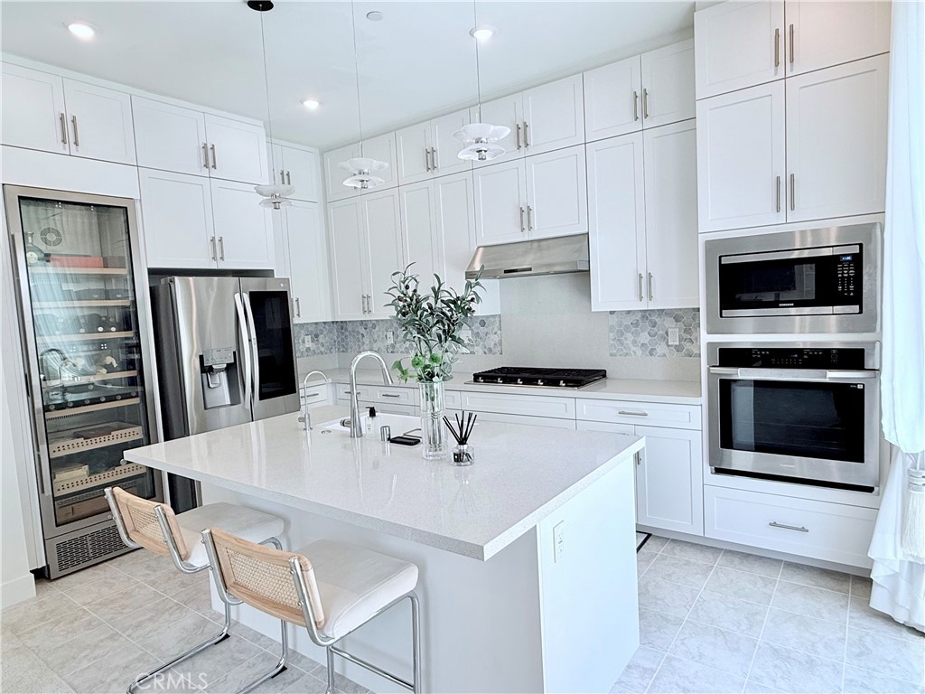 Experience modern elegance in this 2023 new construction, fully upgraded 4-bedroom, 3-bathroom home in the coveted Petra community by Landsea Homes. Just a 3-minute walk from St. Margaret's Episcopal School and close to equestrian facilities and 24 Hour Fitness Super-Sport, this home offers the perfect mix of comfort and convenience.
Built with numerous builder upgrades, including an electric vehicle charging station and an additional washer/dryer setup in the garage, this home is as functional as it is stylish. The open-concept layout features a gourmet kitchen with quartz countertops, a center island, and a walk-in pantry. A converted garage bay serves as a spacious guest room or bonus area, adjacent to a remodeled bathroom with a glass-enclosed shower. Upstairs, a redesigned stairway opens to a large den ideal for an office or entertainment space. The primary suite includes a remodeled bath with a luxurious soaking tub.
This home is equipped with full solar panels for energy efficiency, and offers stunning mountain views and direct sightlines to San Juan Hills Golf Club from the backyard. You'll also enjoy a private driveway, a remaining single-car garage bay, dual-zone wine fridge, stainless steel refrigerator, upstairs washer and dryer, and additional hookups in the garage.
Plenty of community parking is available in designated areas less than a minute's walk from the home. Community amenities include BBQ and picnic areas, fire pits, passive parks, a tot lot, and outdoor fitness stations along a bike trail leading directly to Doheny State Beach. With close access to downtown San Juan Capistrano, the I-5 freeway, and Amtrak/Metrolink, this home offers both luxury and lifestyle.