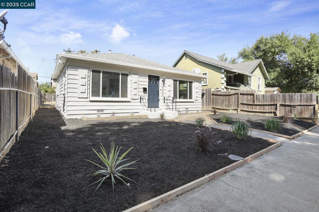 Step into this beautifully renovated 2-bedroom, 1-bathroom home that blends style, comfort, and functionality. From the moment you arrive, the curb appeal and spacious front yard set the tone for what’s inside. Inside, you'll find a stunning open-concept living and kitchen area—perfect for entertaining or relaxing in style. The upgraded fixtures and sleek laminate flooring throughout create a cohesive, modern vibe. The kitchen shines with contemporary finishes and flows effortlessly into the living space, making hosting a breeze. Outside, enjoy a generous backyard ideal for weekend gatherings, gardening projects, or simply soaking up the sun. Whether you're a green thumb or a grill master, this outdoor space is ready for you. The oversized laundry room offers flexibility—use it as a craft room or extra storage space, It’s a bonus area that adapts to your lifestyle. This home is move-in ready and waiting for someone to love it as much as it’s been cared for. Don’t miss your chance to own this gem!