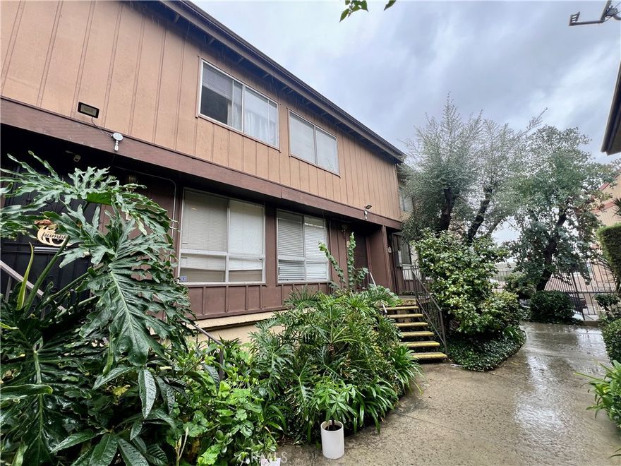 Welcome to 7301 Lennox Ave, Unit #A13, Van Nuys, CA 91405. This bright and spacious 2-bedroom, 1.5-bath condominium townhouse offers approximately 1,079 sq ft within a desirable gated community. You'll find a completely remodeled, open-concept layout featuring a modern living room and dining area. The renovated kitchen is equipped with an alkaline water system. Additional upgrades include a new central AC system, new dual-pane windows, and new laminate flooring throughout. The community amenities feature a swimming pool, covered parking, and a laundry room located just steps from your unit. Its prime location offers convenience near shopping, dining, and public transportation, with easy access to the freeway. Enjoy nearby highlights such as Balboa Park. Don't miss this great opportunity to own a beautiful, move-in-ready home!
