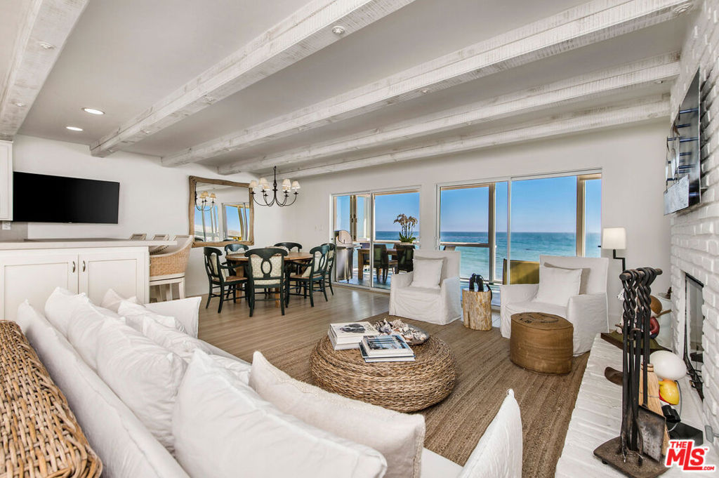 Rare opportunity to own a gorgeous, light filled, airy beach house on the sand in the highly coveted gated Sea Level Drive off of Broad Beach Road. Enjoy spectacular panoramic ocean views on the two expansive decks. Wood burning/gas fireplaces in the living room and primary. Large primary suite with walk-in closet, ensuite bathroom with large soaking tub and dual vanities. Updated throughout and lovingly and meticulously maintained. This special home provides a rare opportunity to enjoy the secluded Sea Level Beach and one of the few houses on the Sea Level sand.
