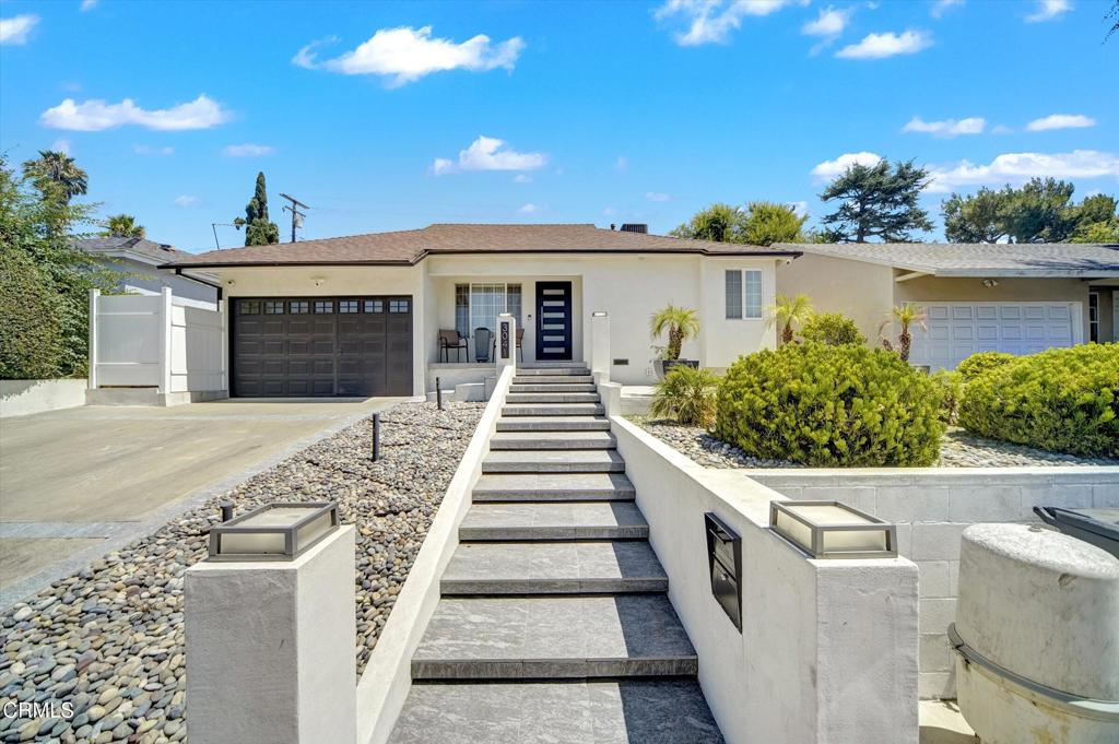 This inviting 3-bedroom, 2-bath home in the heart of La Crescenta features an updated kitchen with an island and a built-in coffee maker and wine cooler. Features a spacious open layout into a large backyard with a sparkling pool and built-in BBQ area, perfect for relaxing or entertaining.
