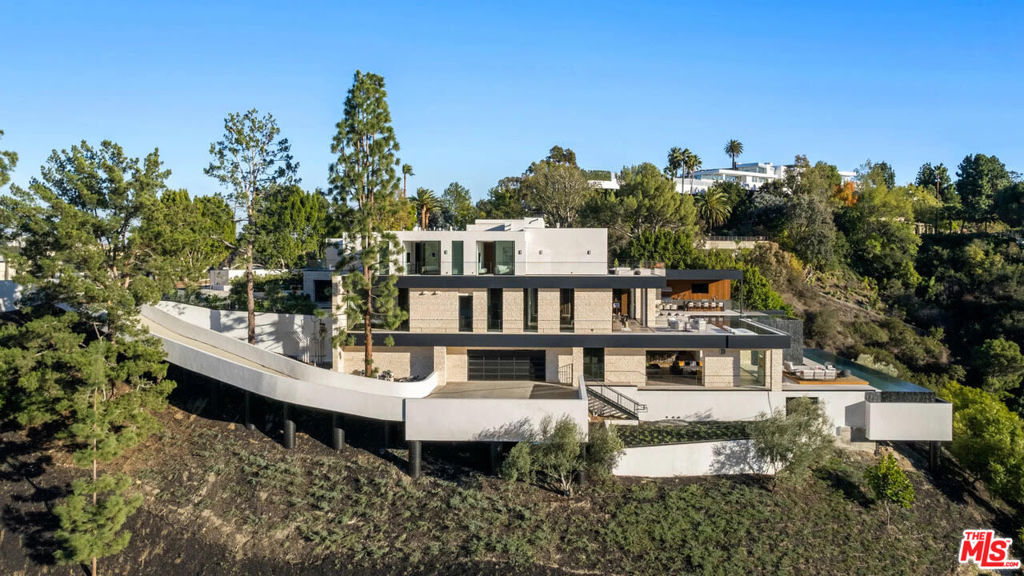 This Amazing Sprawling Bel Air / Holmby Hills Home " Designed by renowned Interior Designer ( Fay Resnick) is Now For Sale. Not a More Spectacular Home in the area exist than this 7 Bedroom 14 Bathroom "Gem" that is strategically located High above The Los Angeles Basin with Views of Downtown LA, The Pacific Ocean and Beyond. Ideal for Filming Movies as Several Have already been Filmed here already. There is 12,130 SQ Feet of Living Space , 58,000 SQ Ft Lot which includes 3 Large Levels with Pools and Waterfalls and on 2 Levels, Views from Several Bedrooms with Fireplaces in 3 Bedrooms, Living Room and Dining Area. Lower Lever has Indoor Wellness Retreat with a Luxury Spa, Fitness Room, Steam and Jacuzzi. The Retracting Glass opens to a Huge 73 Foot Pool on Level One where the Serenity of the Most Amazing Views in the City Exist that Creates a " Zen Like " environment when entering a Back yard that Includes a Large outdoor Bar/ BBQ Cook area Ocean, City and Mountain Views that will Rival any around ! The Open Wine Room can Store over 150 Bottles of Wine , While the Office, Dens and Theatre Room are nothing less that "State of the Art". Paradise Awaits !