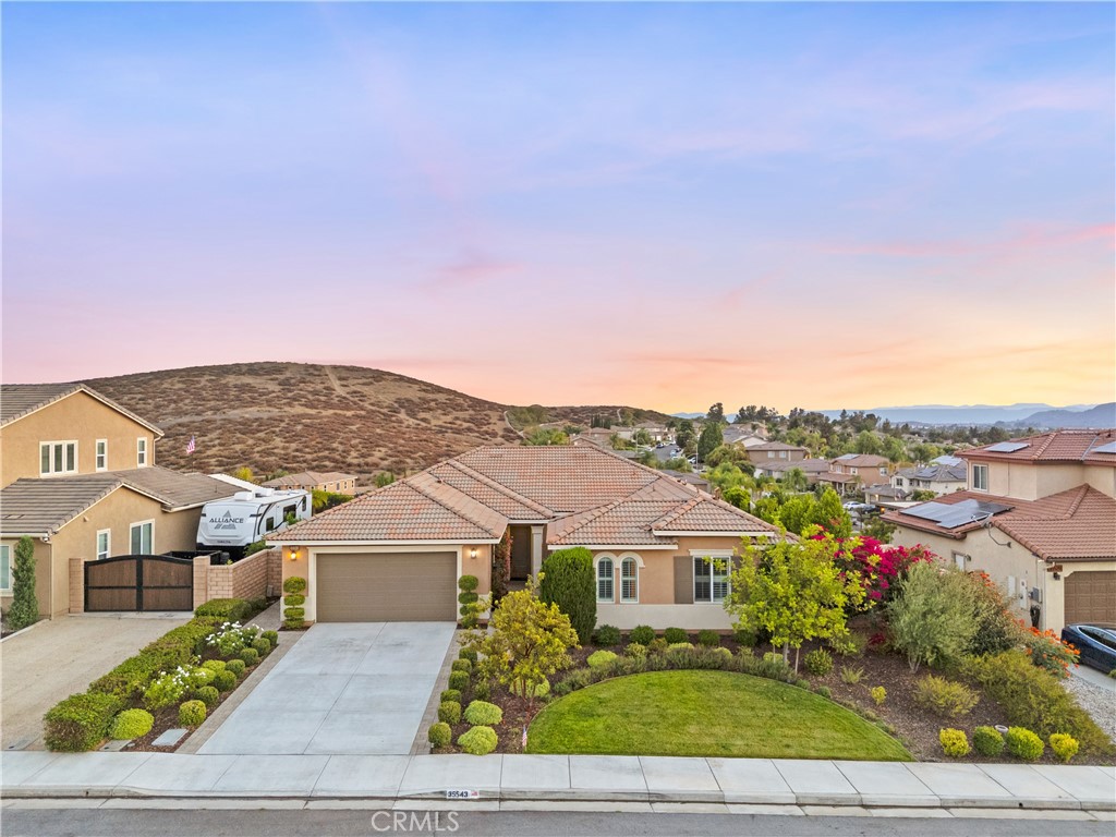 Luxury Single-Story with Designer Upgrades & Breathtaking Views! Welcome to this stunning single-story home located in the highly sought-after Morningstar Ranch community. This beautifully upgraded 3-bedroom, 2.5-bath residence features over 2,500 sq ft of elegant living space, with designer touches throughout including wide plank hardwood floors, crown molding, plantation shutters, and custom woodwork. The gourmet kitchen is a chef’s dream, showcasing quartz countertops, a farmhouse sink, pot filler, walk-in pantry, beverage bar, and high-end stainless steel appliances—including double ovens and a built-in microwave. The spacious open floor plan includes a formal dining room with built-in cabinetry and wine fridge, a large living room with a marble fireplace, and a flexible front room perfect for an office or den. The luxurious primary suite offers a spa-like bath with dual vanities, a soaking tub, walk-in shower, and large closet. Step outside to your private entertainer’s backyard featuring a custom spool (spa/pool combo), built-in BBQ, outdoor fireplace, bocce court, garden beds, and breathtaking hill views. The inviting front courtyard adds charm and curb appeal, while the tandem 3-car garage provides ample space. This turnkey home truly has it all—style, functionality, and resort-style living.
