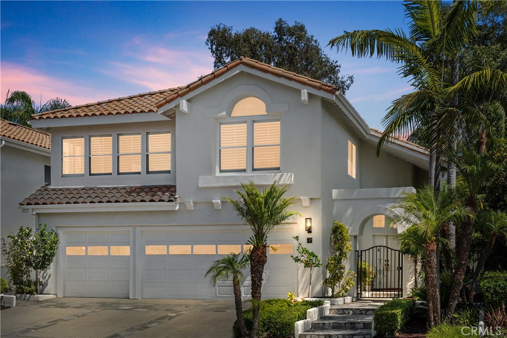 Venture into refined coastal Marina Hill's living in one of the largest but rare model homes to come on the market! This home has been beautifully updated and is ready to move in! PEX REPIPE/ 5-bedroom (downstairs bedroom is en-suited), 3.5-bathroom, nearly 3000 sq ft home won’t disappoint and has fresh paint inside and out, with every aspect thoughtfully curated, this home offers unparalleled style, space, and access to resort-style amenities! Inside, you’ll find a bright, expansive floor plan with soaring ceilings and impeccable finishes throughout. A grand foyer opens to an airy living space with new LVP flooring throughout the main floor and continues up the stunning staircase that sets the tone for the elegance within. A unique feature is a stylish wet bar that bridges the downstairs living spaces and creates an entertainer's setting for future gatherings and effortless hosting. The heart of the home is the chef’s kitchen, remodeled with sleek quartz countertops, new Stainless-Steel appliances to include, dual Kitchen Aid ovens and dishwasher, Jenn Air five-burner gas stove and microwave, a wine refrigerator and crisp white cabinetry, plus an island with sink! A functional kitchen, cozy family room with fireplace, along with a spacious downstairs ensuited bedroom makes this home ideal for multigenerational living! Upstairs, retreat to the luxurious primary suite with high ceilings, a double-sided fireplace, private balcony, spa-like bathroom with soaking tub, quartz counters, and an oversized walk-in closet. Three additional generously sized bedrooms, with mirrored closet doors, shutters, and an updated full bath complete the upper level. Natural light floods in through dining room French doors and a stunning chandelier, that leads to a private, lushly landscaped backyard oasis complete with multiple patios perfect for al fresco dining, relaxing or adding a pool! Other worthy features: 2024 Rheem water heater, newer HVACs, Lenox AC's, outdoor carpeted garage, and more! Award winning Marina Hills community includes a Jr. Olympic pool, spa, pickleball and tennis courts, tot pool, clubhouse, and year-round events, this home also offers easy access to the scenic Salt Creek Trail leading directly to Salt Creek Beach and the Waldorf Astoria. This floor plan rarely comes on the market—don’t miss the opportunity to call this stunning property your forever home!