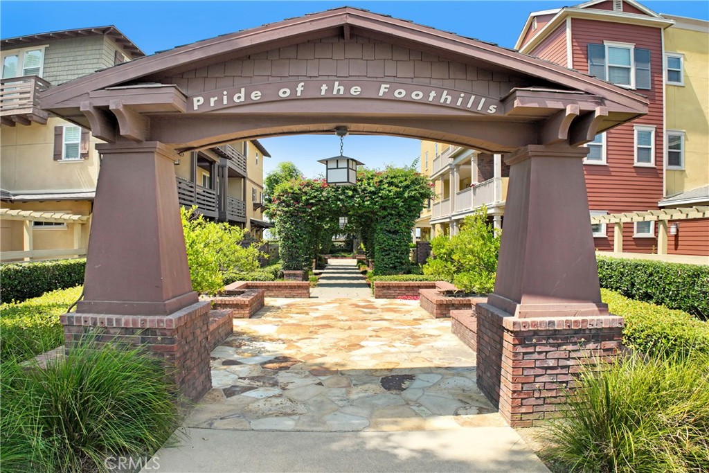 Nestled in a gated community of Glendora, at the base of the scenic San Gabriel Mountains, this modern three-level townhome offers 3 bedrooms, 3.5 baths, and a highly functional layout with upgraded finishes throughout. Built in 2013, the home features paid-off solar panels, updated vinyl flooring, and a spacious two-car attached garage. The first floor includes a private bedroom and full bath—ideal for guests or a home office—with direct garage access. The second level boasts an open-concept kitchen, living, and dining space with a large quartz island, a private balcony perfect for grilling or morning coffee, and a convenient half bath. Upstairs, you’ll find two generous primary suites with upgraded tile bathrooms, ample closet space, and an additional private patio off the larger suite. Enjoy peaceful walkways, lush landscaping, and close proximity to downtown Glendora’s shops and restaurants—all within walking distance. This move-in ready home blends modern comfort with energy efficiency and a prime location.